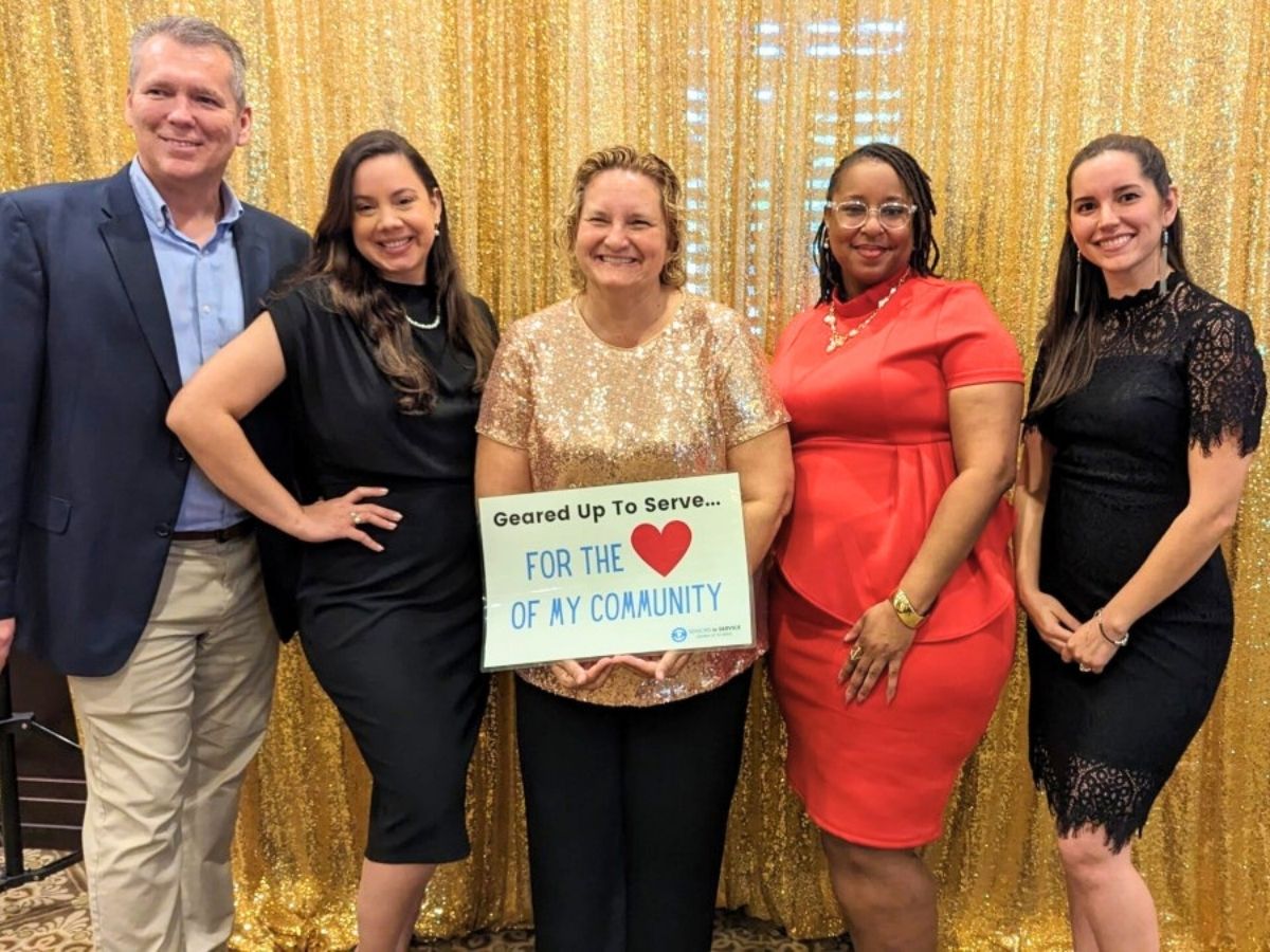 Seniors in Service staff gather with an AmeriCorps representative for a photo at the Annual Volunteer Appreciation Luncheon.