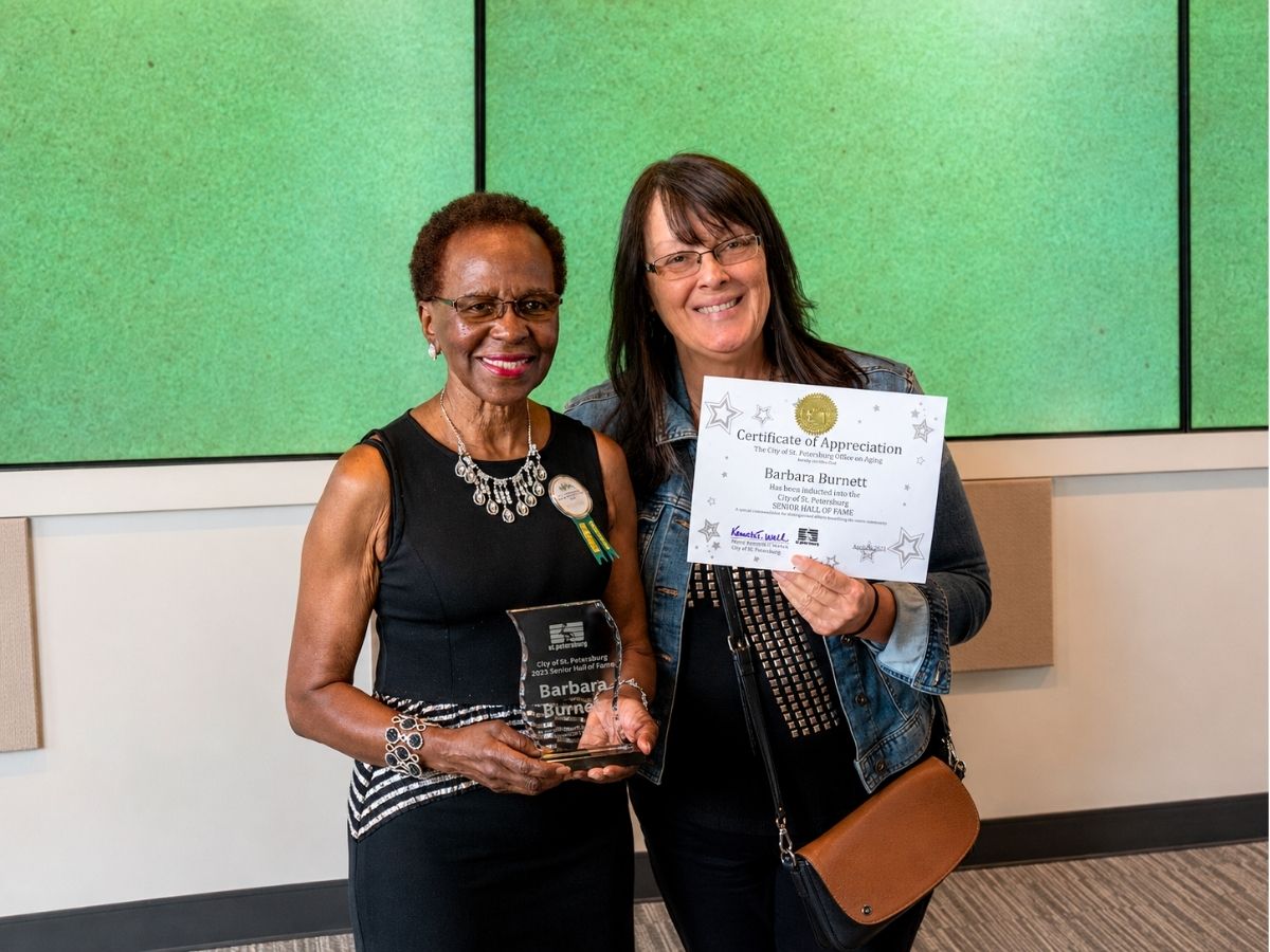Classroom Grandparent Barbara Burnett receives her St. Petersburg Senior Hall of Fame award and certificate in recognition of her volunteer service.