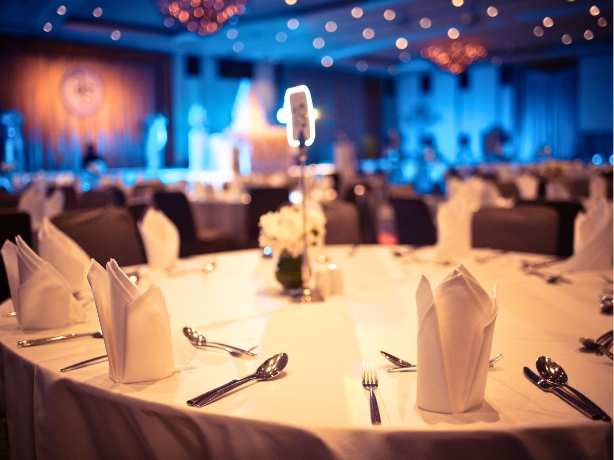 An event venue prepared for the Seniors in Service 40th Anniversary Bridging Generations Dinner before Hurricane Helene forced the event's cancellation.