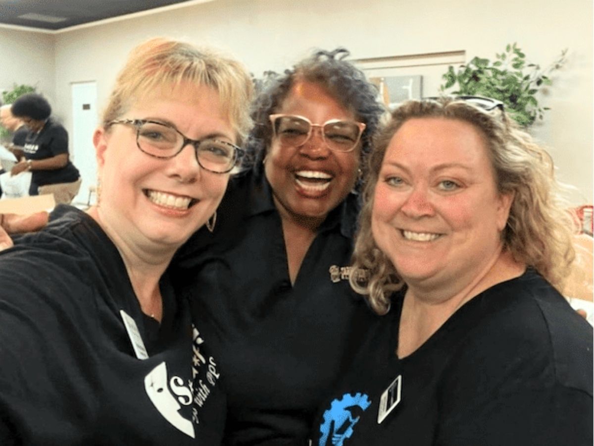 Carmen Lake, center, celebrates with fellow Seniors in Service volunteers after two decades of dedicated community service in Pinellas County.