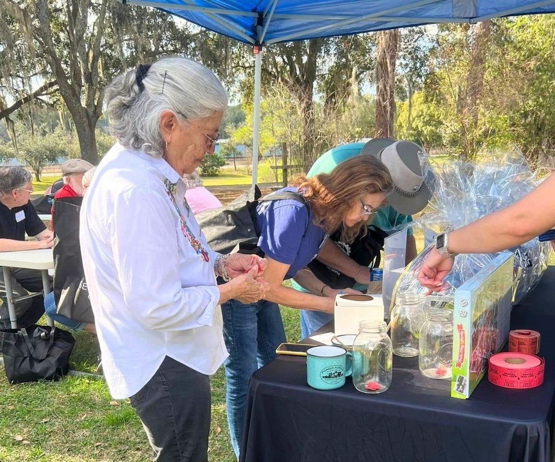 Volunteers participate in raffle activities and community fellowship during a Geared Up Gathering appreciation event.