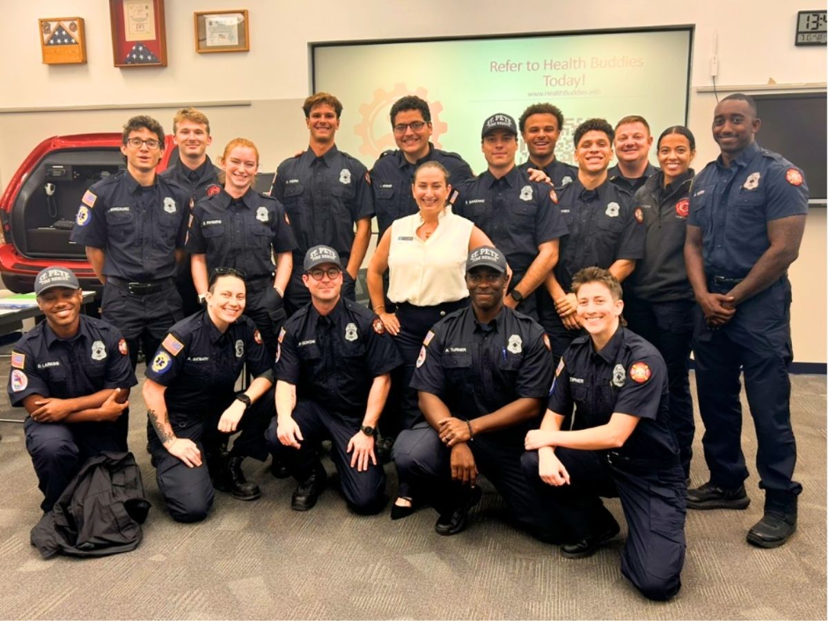 St. Petersburg Fire Rescue personnel pose with a Seniors in Service representative after Health Buddies program training for senior wellness referrals.