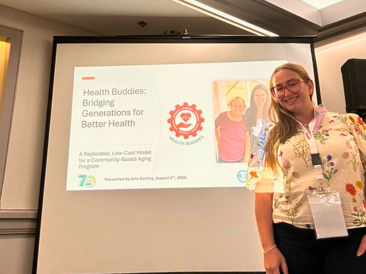 Health Buddies Program Manager Aria Garling presents at the Florida Conference on Aging about improving senior wellness through volunteer connection.