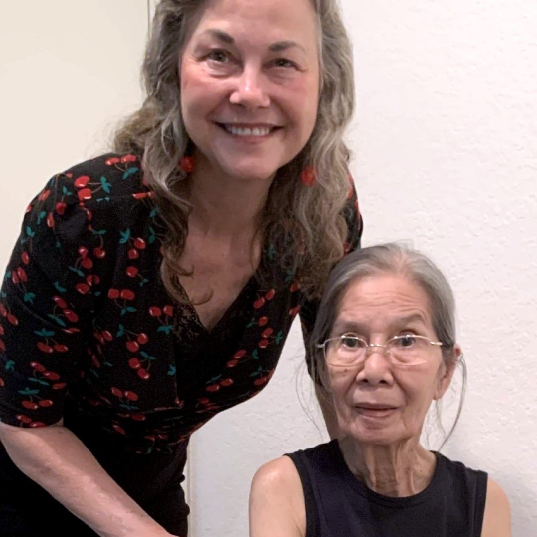 Senior Companion volunteer Nona visits with Diana, providing companionship, support, and wellness monitoring that helped ensure Diana received emergency care when she needed it most.