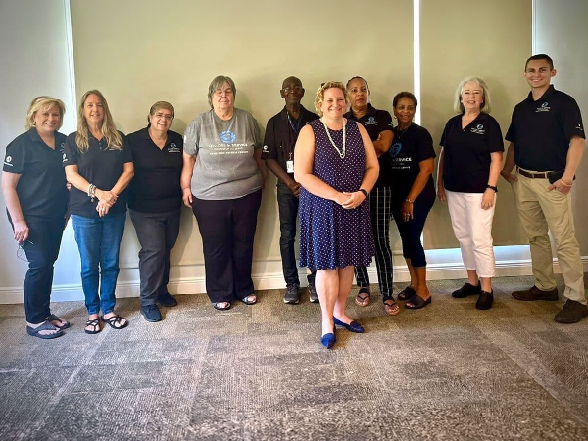 Operation: Veteran Connect volunteers pose together after completing four years of service supporting veterans across Tampa Bay.