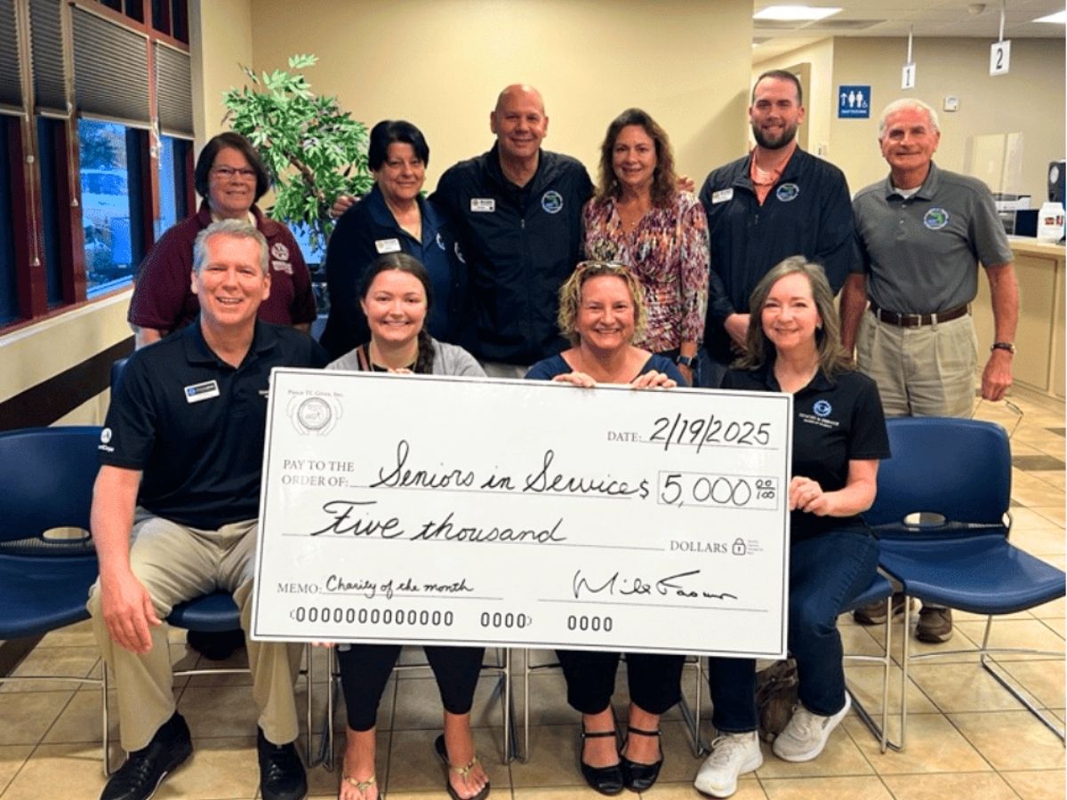 Pasco County Tax Collector staff present a $5,000 charitable donation to Seniors in Service to support older adults and volunteer programs in Pasco County.