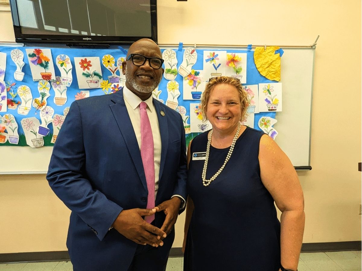 Seniors in Service CEO Robin Ingles smiling with St. Petersburg Mayor Ken Welch at a community event.