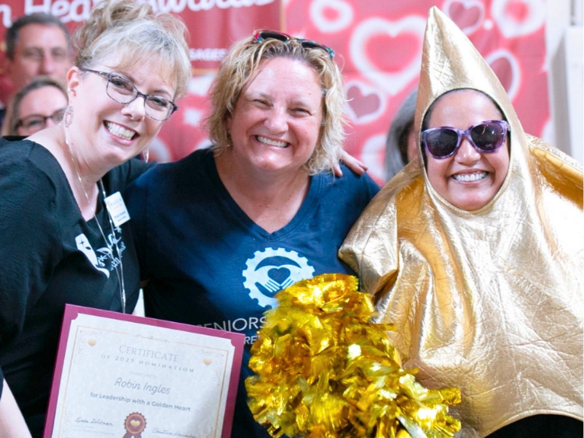 Seniors in Service CEO Robin Ingles accepting a Leadership with a Golden Heart nomination at the 2025 SAGES Golden Hearts Awards.