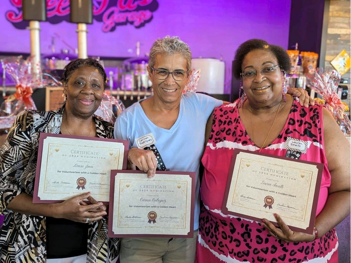 Senior Companion volunteers display Golden Hearts Award certificates recognizing their outstanding service to older adults in Pinellas County.