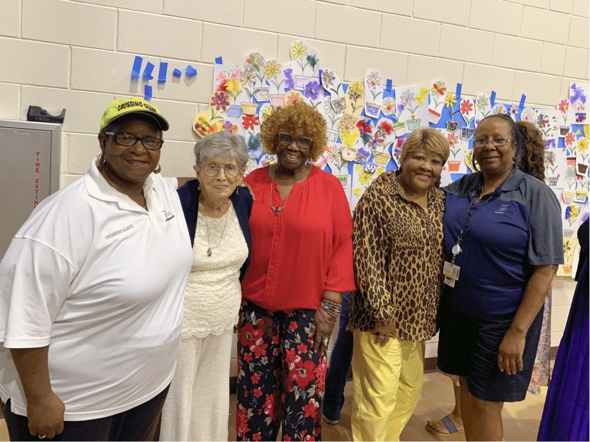 Senior Companion volunteers gather at a community event celebrating friendship, purpose, and meaningful connections through Seniors in Service.