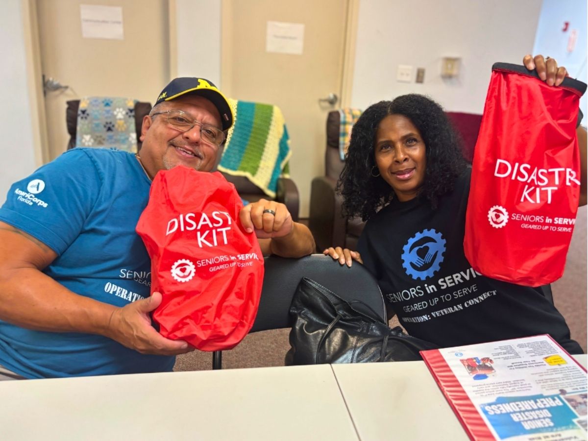 Seniors in Service Operation: Veteran Connect volunteers display Senior Disaster Support emergency preparedness kits for older adults before hurricane season.