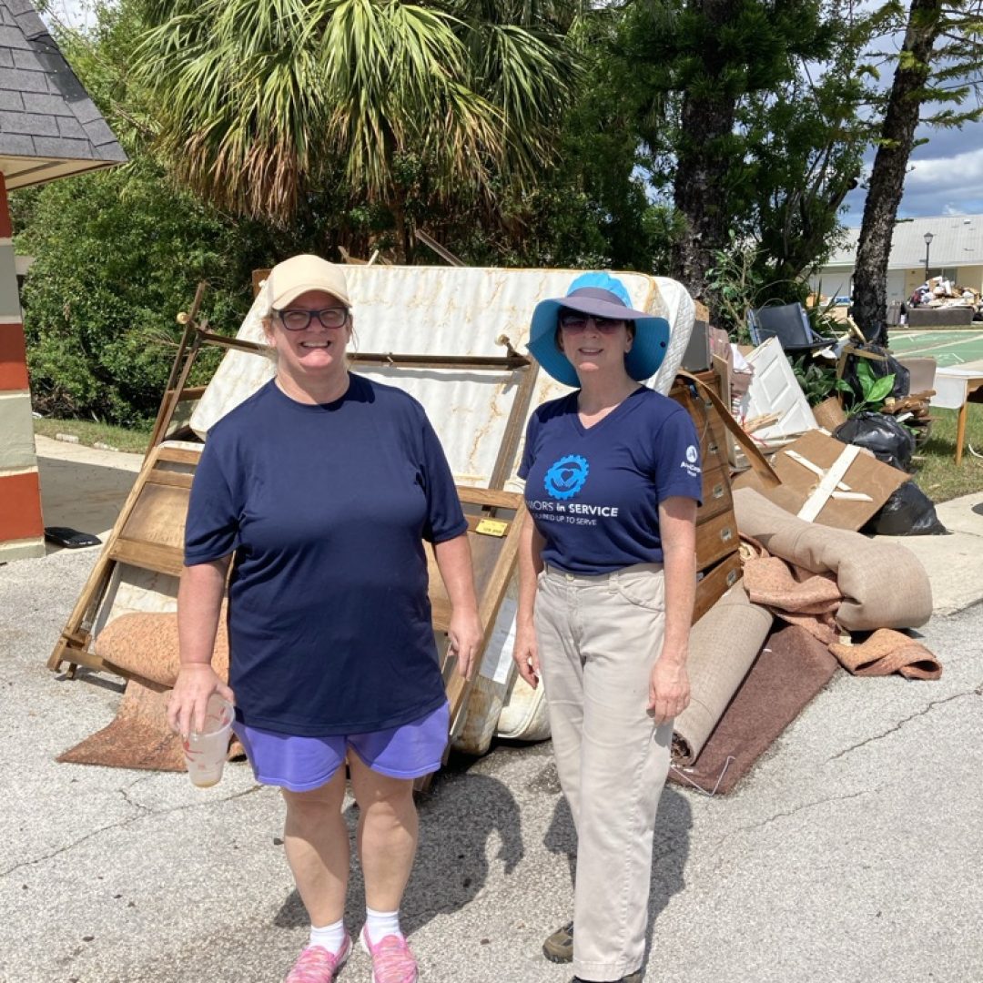 Volunteers help clean up debris left from hurricanes.