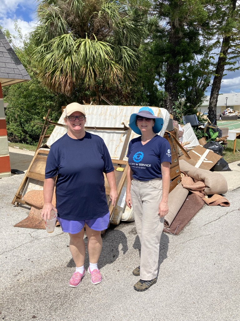 Volunteers help clean up debris left from hurricanes.