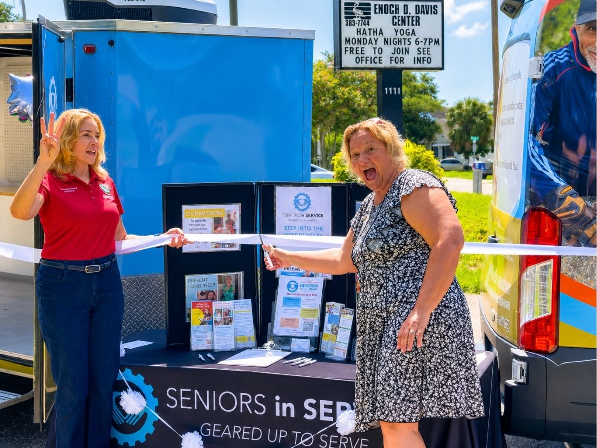 Seniors in Service staff and supporters celebrate the ribbon cutting of the new Mobile Outreach Unit in Pinellas County.