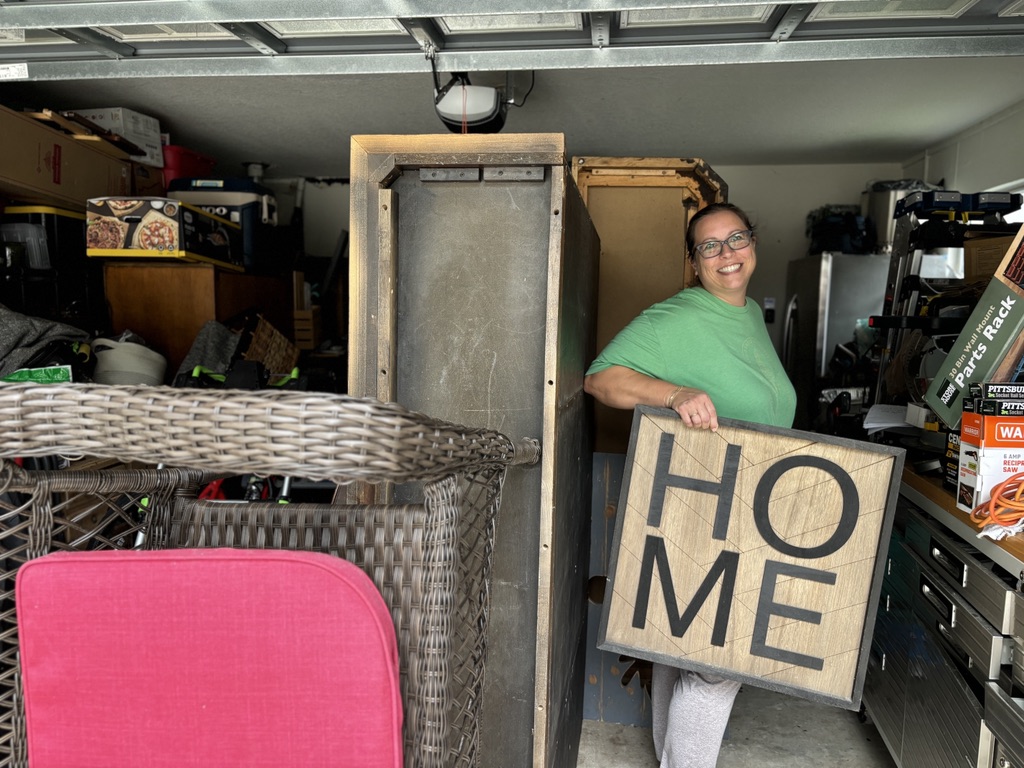 Operation: Veteran Connect volunteer prepares donated furniture and a HOME sign for delivery to a senior or veteran rebuilding after hardship in Tampa Bay.