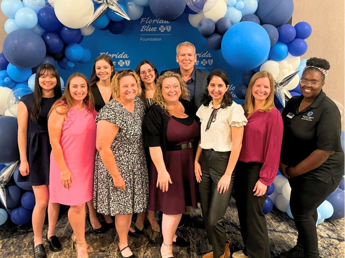 Seniors in Service staff smile for a group photo at the Florida Blue Conference in Tampa Bay.