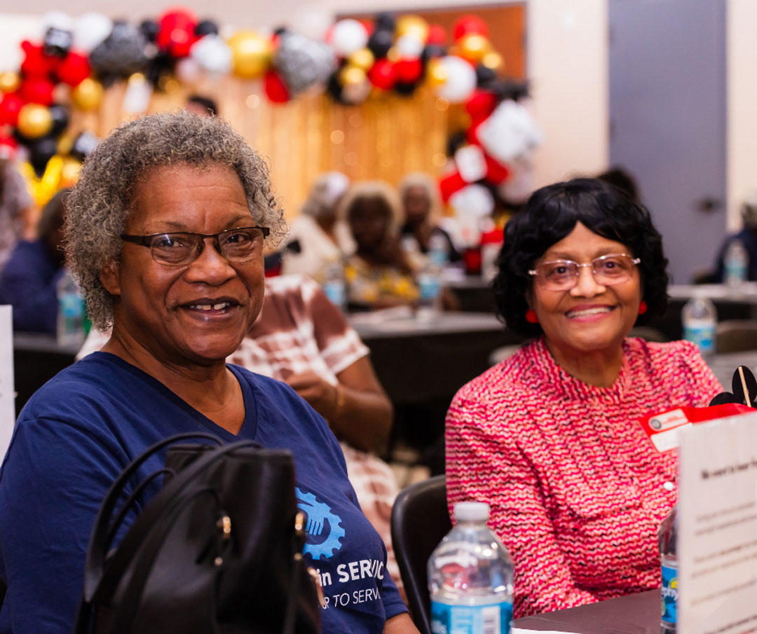 Seniors in Service volunteers smile during the "Lucky to Have You" volunteer appreciation celebration.